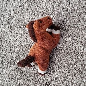 Tiny horse stuffed animal.